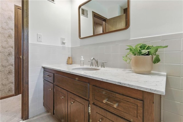 7100 Antioch Rd, Merriam, KS 66204 - bathroom with vanity and tile walls