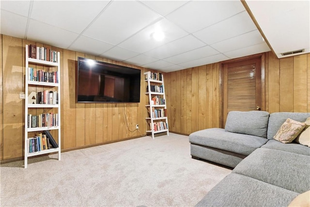 7100 Antioch Rd, Merriam, KS 66204 - carpeted living room featuring wooden walls, a paneled ceiling, and built in features