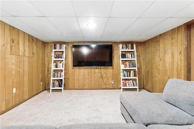 7100 Antioch Rd, Merriam, KS 66204 - living area featuring wood walls, carpet flooring, built in shelves, and a drop ceiling