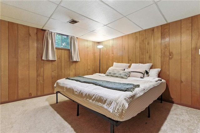 7100 Antioch Rd, Merriam, KS 66204 - bedroom with carpet, a paneled ceiling, and wooden walls