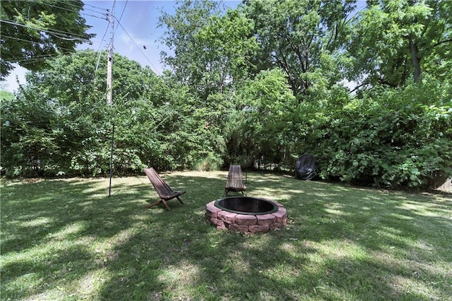 7100 Antioch Rd, Merriam, KS 66204 - view of grassy yard featuring a fire pit