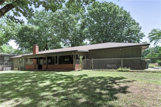 7100 Antioch Rd, Merriam, KS 66204 - back of house with a chimney, brick siding, board and batten siding, and a sunroom