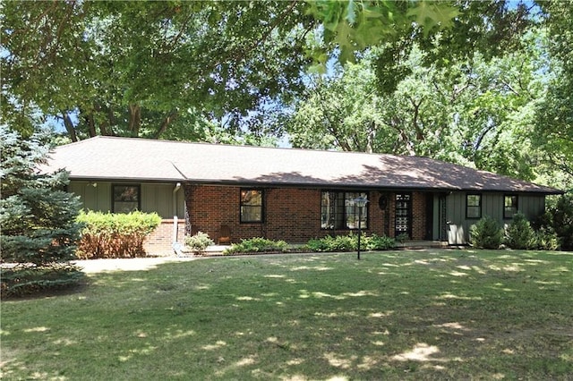 7100 Antioch Rd, Merriam, KS 66204 - ranch-style home featuring board and batten siding, a front lawn, and brick siding