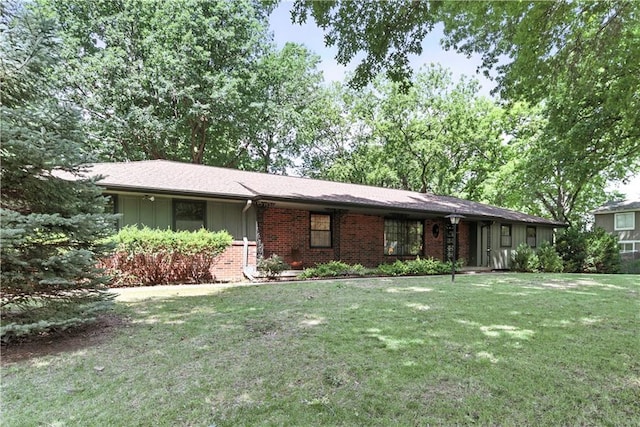 7100 Antioch Rd, Merriam, KS 66204 - single story home featuring brick siding, a front yard, and board and batten siding