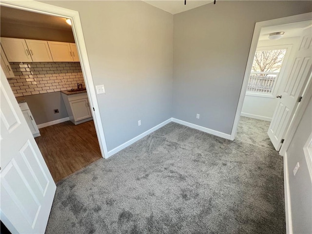 11117 E 15th St S, Independence, MO 64052 - unfurnished bedroom featuring carpet floors and baseboards