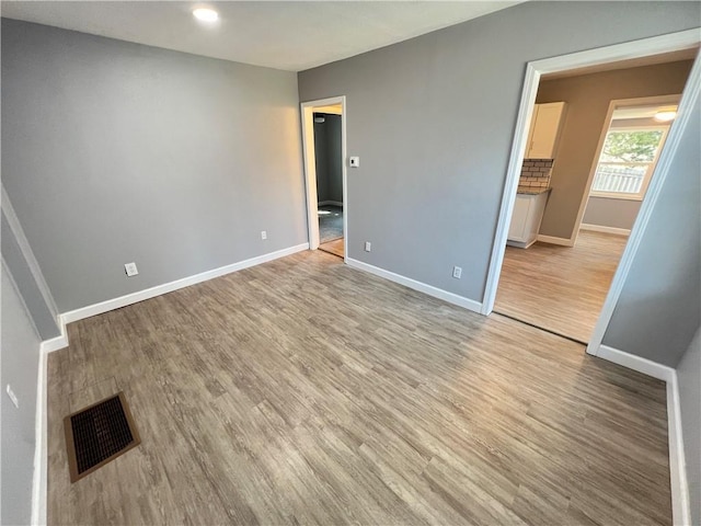 11117 E 15th St S, Independence, MO 64052 - unfurnished bedroom with light wood-type flooring and recessed lighting