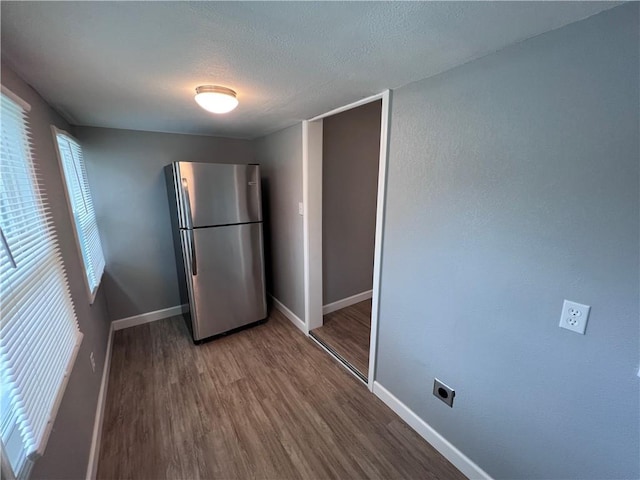 11117 E 15th St S, Independence, MO 64052 - kitchen featuring freestanding refrigerator, wood finished floors, and a textured ceiling