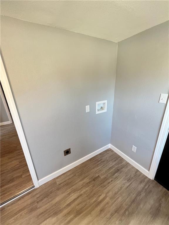 11117 E 15th St S, Independence, MO 64052 - empty room with baseboards and wood finished floors
