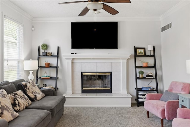 14162 W 150th Ct, Olathe, KS 66062 - carpeted living room with a ceiling fan, ornamental molding, and a tile fireplace