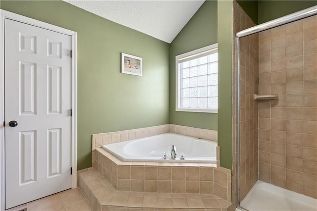 14162 W 150th Ct, Olathe, KS 66062 - bathroom featuring a bath, a shower stall, vaulted ceiling, and tile patterned flooring