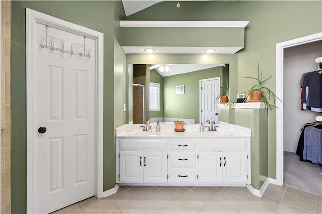 14162 W 150th Ct, Olathe, KS 66062 - bathroom with lofted ceiling, a shower stall, tile patterned floors, double vanity, and a ceiling fan