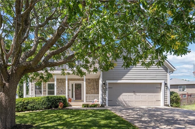 14162 W 150th Ct, Olathe, KS 66062 - view of front facade with driveway, an attached garage, and stone siding