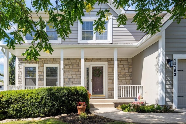 14162 W 150th Ct, Olathe, KS 66062 - view of front facade featuring a porch and stone siding