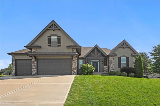 704 SW Admiral Byrd Dr, Lees Summit, MO 64082 - view of front of property with stucco siding, a front lawn, driveway, and a garage
