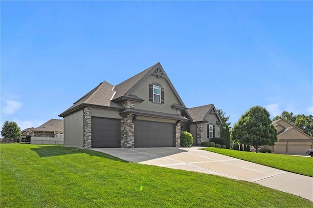 704 SW Admiral Byrd Dr, Lees Summit, MO 64082 - view of front of property featuring driveway, stucco siding, a garage, and stone siding