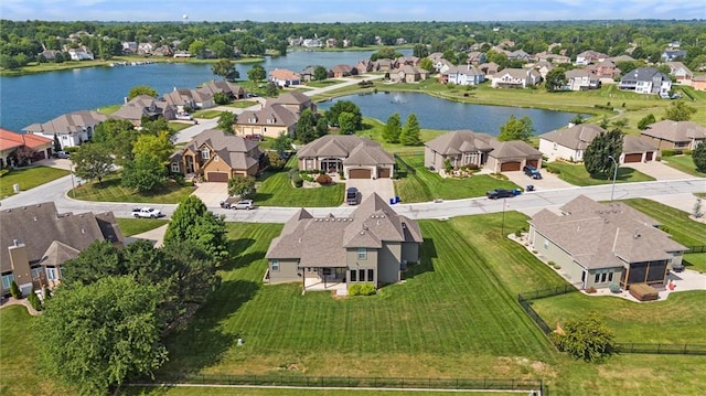 704 SW Admiral Byrd Dr, Lees Summit, MO 64082 - aerial perspective of suburban area featuring a nearby body of water