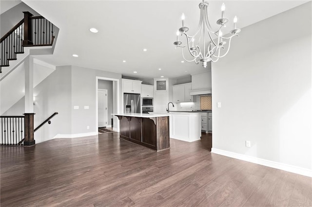 704 SW Admiral Byrd Dr, Lees Summit, MO 64082 - kitchen with a large island, stainless steel appliances, dark wood-style flooring, a chandelier, and recessed lighting