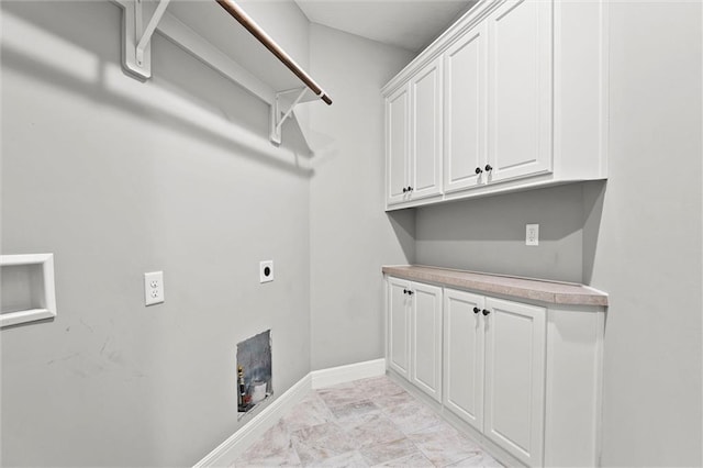 704 SW Admiral Byrd Dr, Lees Summit, MO 64082 - laundry area with hookup for an electric dryer, cabinet space, and light marble finish floors