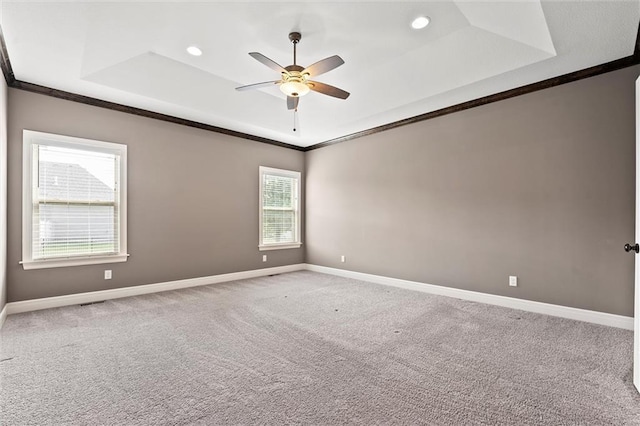704 SW Admiral Byrd Dr, Lees Summit, MO 64082 - unfurnished room featuring a raised ceiling, crown molding, ceiling fan, carpet, and recessed lighting