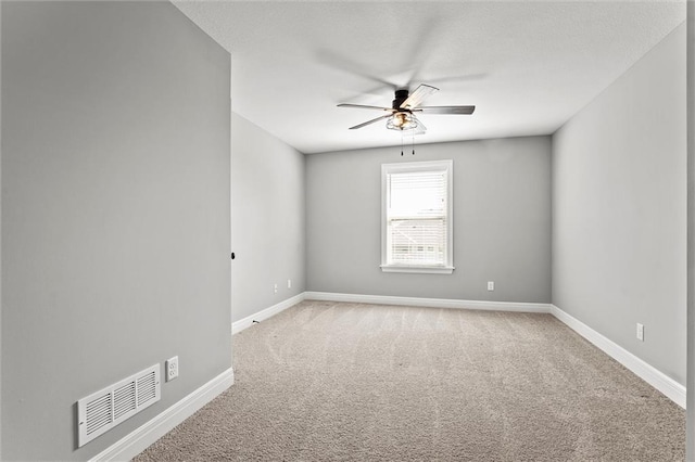 704 SW Admiral Byrd Dr, Lees Summit, MO 64082 - spare room with a ceiling fan and carpet floors