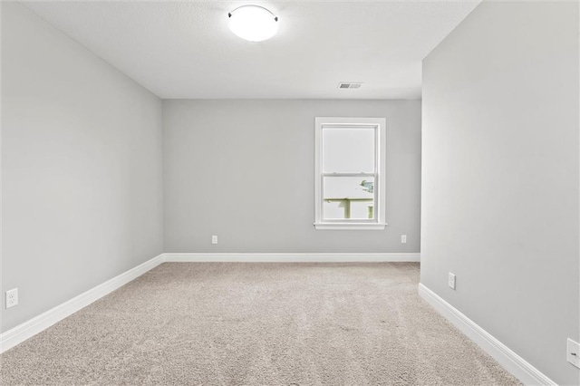 704 SW Admiral Byrd Dr, Lees Summit, MO 64082 - empty room featuring carpet floors and baseboards