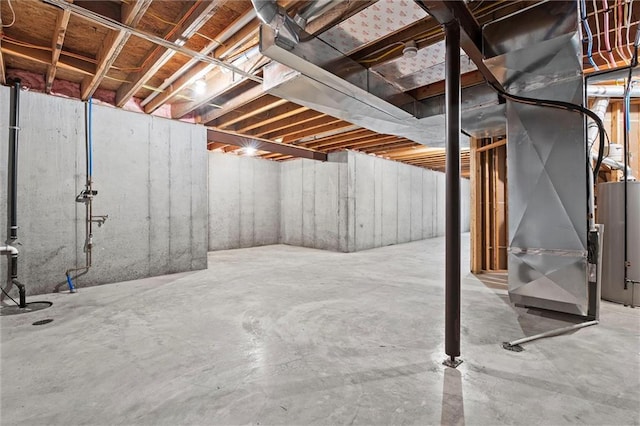 704 SW Admiral Byrd Dr, Lees Summit, MO 64082 - unfinished basement featuring gas water heater and heating unit