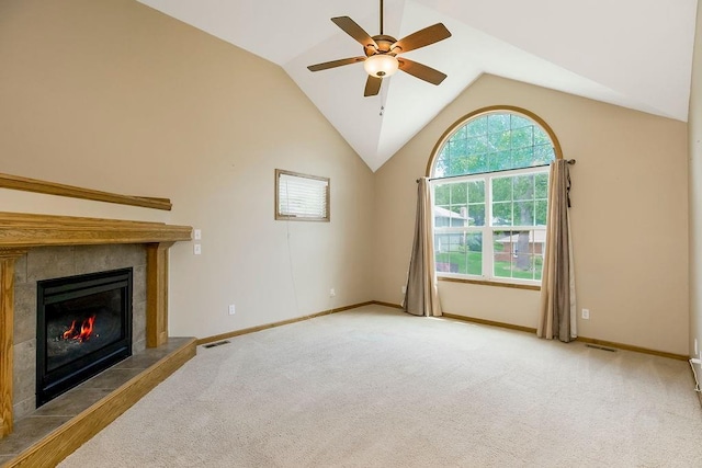 2504 Frances Ave, Leavenworth, KS 66048 - unfurnished living room featuring a ceiling fan, carpet, a tile fireplace, and lofted ceiling
