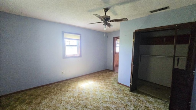 1443 215th St, Fort Scott, KS 66701 - unfurnished bedroom featuring carpet flooring, a closet, and ceiling fan