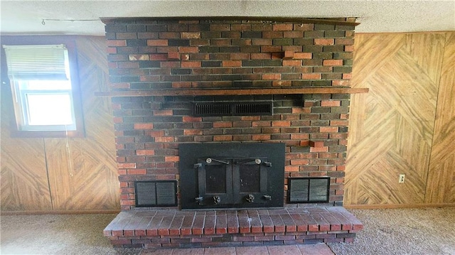 1443 215th St, Fort Scott, KS 66701 - detailed view of wooden walls, a fireplace, and carpet flooring
