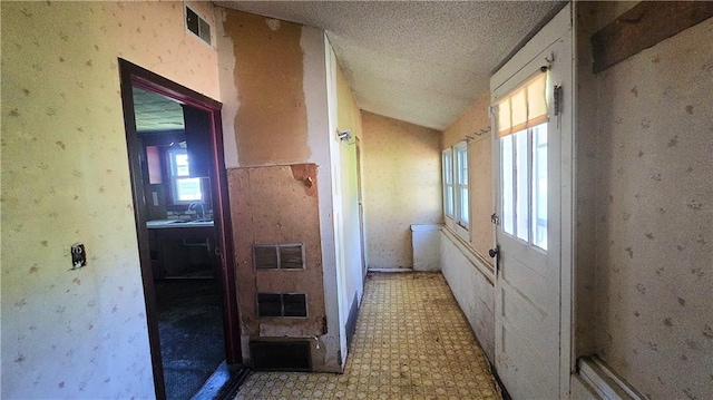 1443 215th St, Fort Scott, KS 66701 - corridor featuring light floors and a textured ceiling