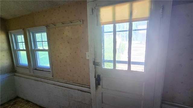 1443 215th St, Fort Scott, KS 66701 - doorway with wallpapered walls and plenty of natural light