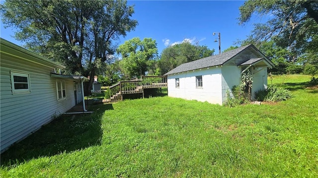1443 215th St, Fort Scott, KS 66701 - view of grassy yard with a wooden deck