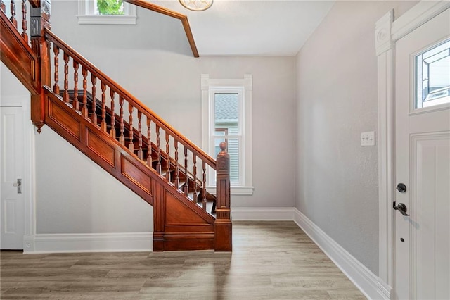 306 W 4th St, Cameron, MO 64429 - entrance foyer with plenty of natural light, stairs, and wood finished floors