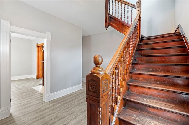 306 W 4th St, Cameron, MO 64429 - stairway with baseboards and wood finished floors