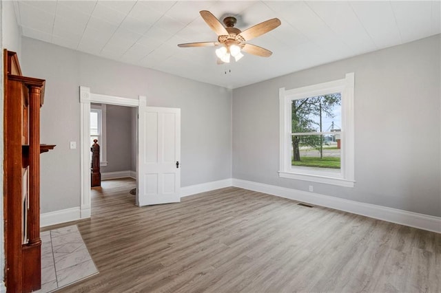 306 W 4th St, Cameron, MO 64429 - unfurnished room with wood finished floors and ceiling fan