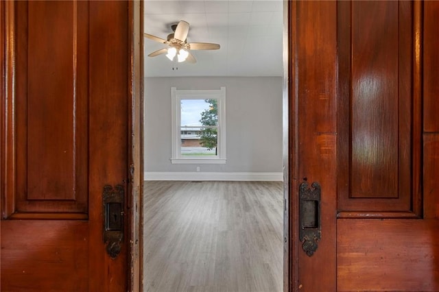 306 W 4th St, Cameron, MO 64429 - corridor featuring baseboards and wood finished floors