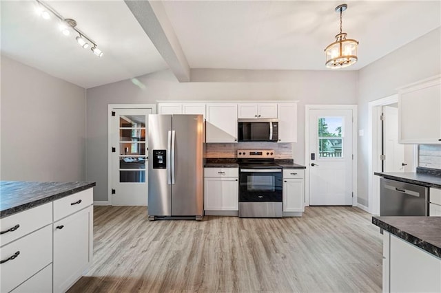 306 W 4th St, Cameron, MO 64429 - kitchen featuring stainless steel appliances, dark countertops, light wood-style floors, and white cabinetry