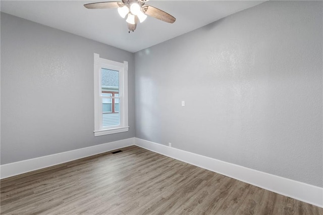 306 W 4th St, Cameron, MO 64429 - empty room featuring ceiling fan and wood finished floors