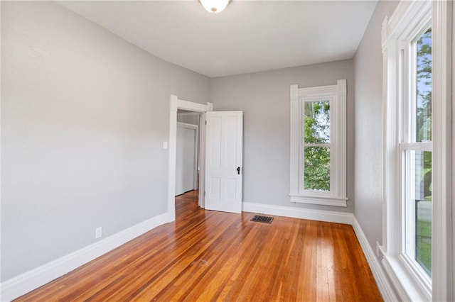 306 W 4th St, Cameron, MO 64429 - unfurnished room featuring hardwood / wood-style flooring and baseboards