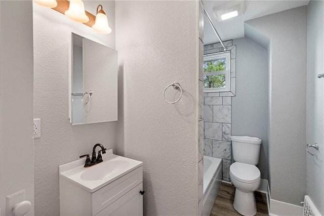 306 W 4th St, Cameron, MO 64429 - full bathroom featuring vanity, wood finished floors, shower / bath combination, and a textured wall