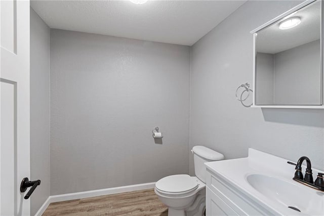 306 W 4th St, Cameron, MO 64429 - half bath featuring wood finished floors and vanity