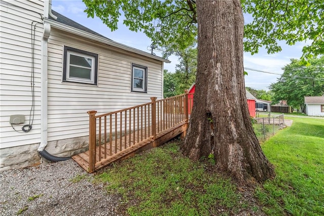306 W 4th St, Cameron, MO 64429 - wooden deck with a lawn