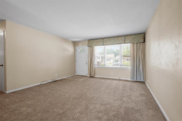 802 W 39th St N, Independence, MO 64050 - carpeted empty room with a textured ceiling