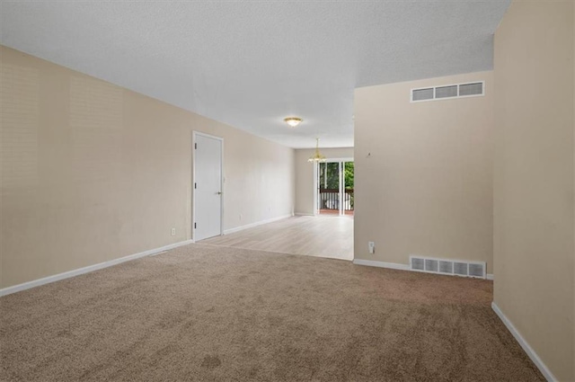 802 W 39th St N, Independence, MO 64050 - carpeted spare room with a chandelier and baseboards