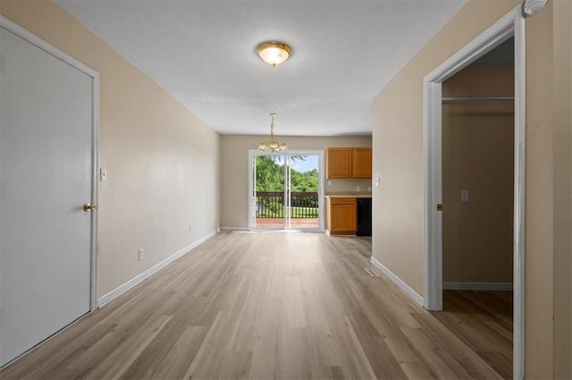 802 W 39th St N, Independence, MO 64050 - unfurnished room with a chandelier, light wood finished floors, and a smoke detector