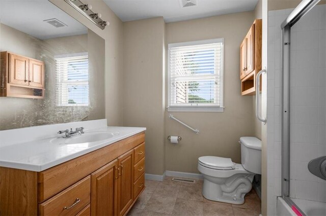 802 W 39th St N, Independence, MO 64050 - full bath with vanity, tile patterned flooring, and shower / bath combination with glass door
