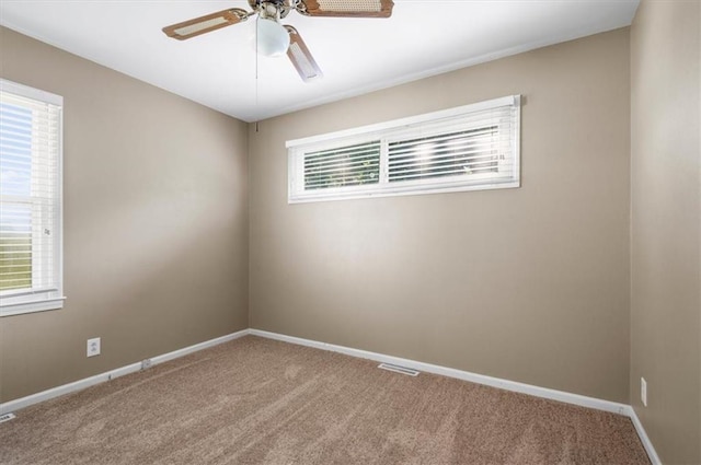 802 W 39th St N, Independence, MO 64050 - carpeted spare room featuring ceiling fan and baseboards