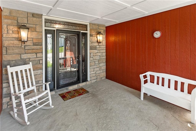 1310 Norfolk Dr, Harrisonville, MO 64701 - entrance to property featuring stone siding and a porch