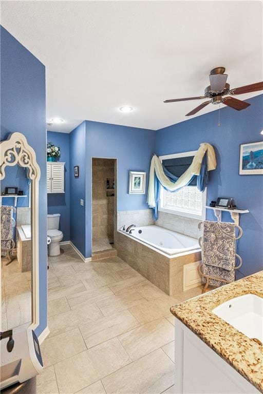 1310 Norfolk Dr, Harrisonville, MO 64701 - full bathroom featuring a garden tub, vanity, a ceiling fan, and a tile shower