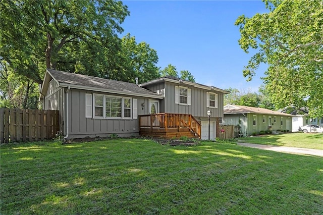 331 E 100th Ter, Kansas City, MO 64114 - view of front facade featuring board and batten siding and a deck
